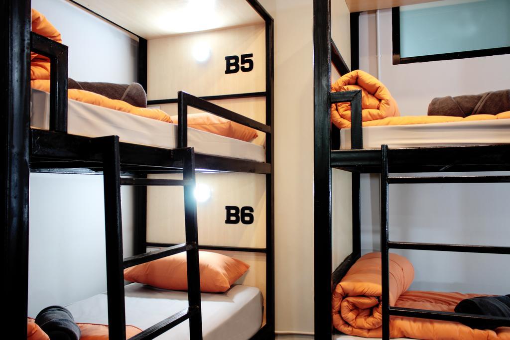 Tempat tidur di Kamar Asrama Campuran 6 Tempat Tidur.